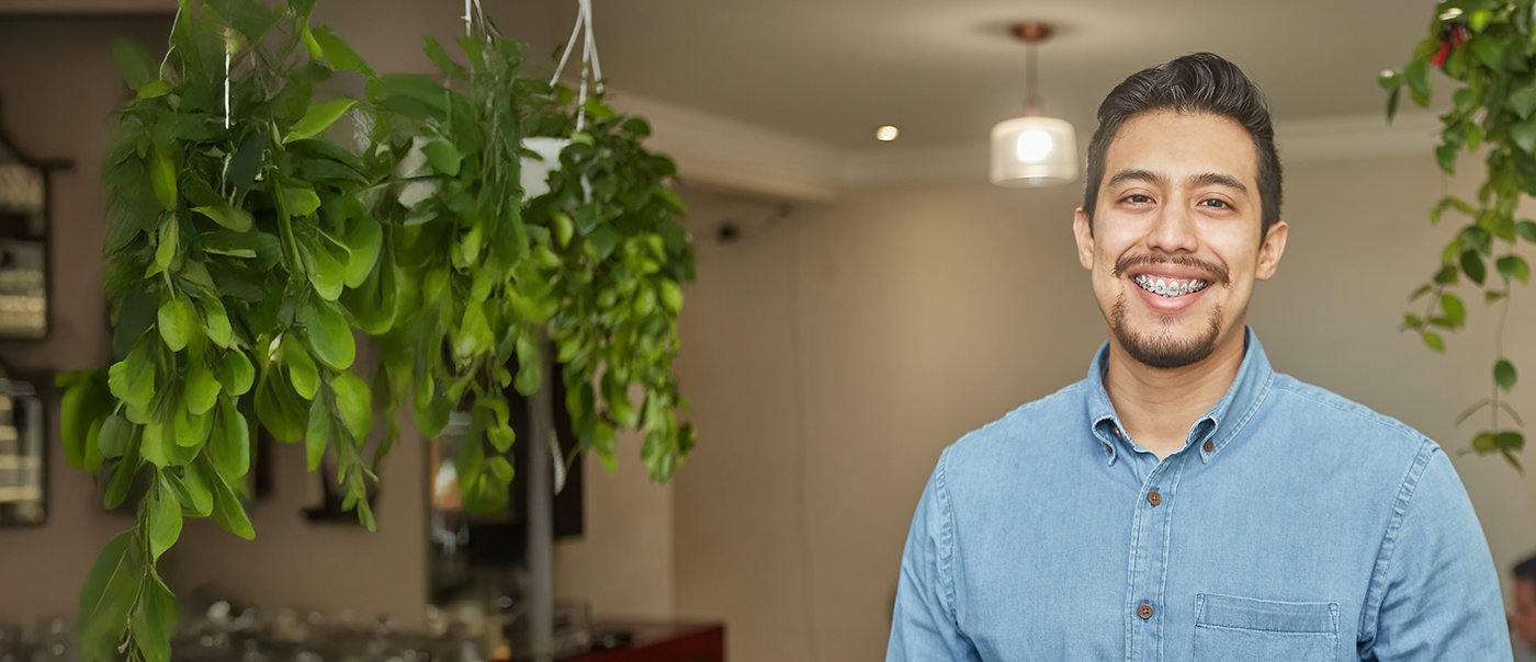 Smiling man with traditional braces
