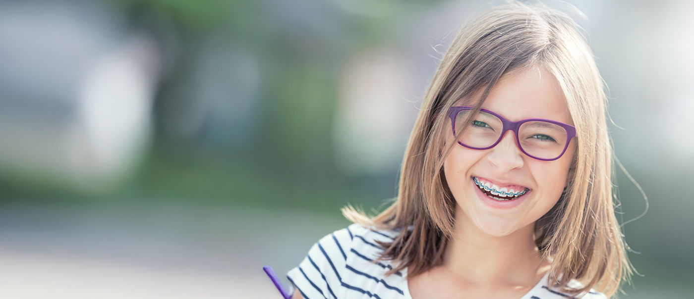 Smiling teenage girl with braces