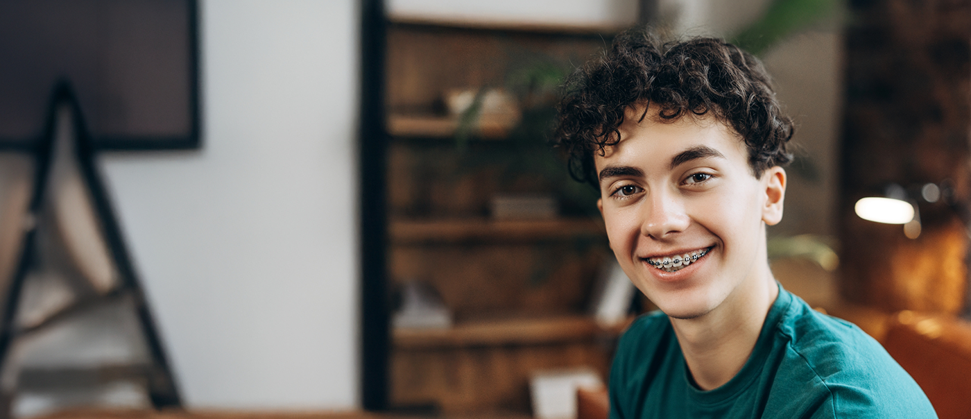 Teenage boy smiling with braces