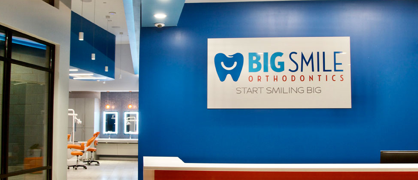 Sign that reads Big Smile Orthodontics Start Smiling Big