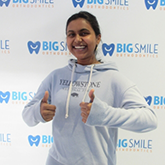 Young woman giving two thumbs up