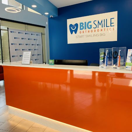 Big Smile Orthodontics sign behind the front desk