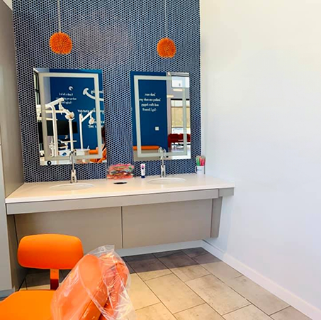Two sinks with mirrors in a Round Rock orthodontic office